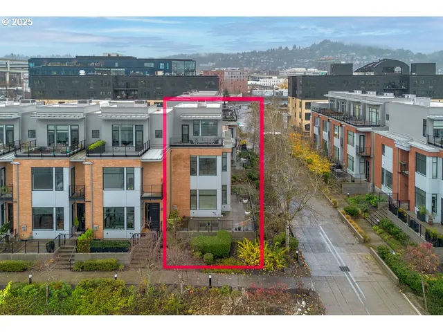 a front view of building with yard and mountain view