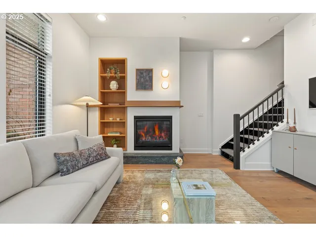 a living room with furniture and a fireplace