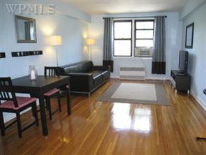 142 Garth Road, Unit 3S Scarsdale, NY 10583 - Photo 1 of 1 a living room with furniture and a window