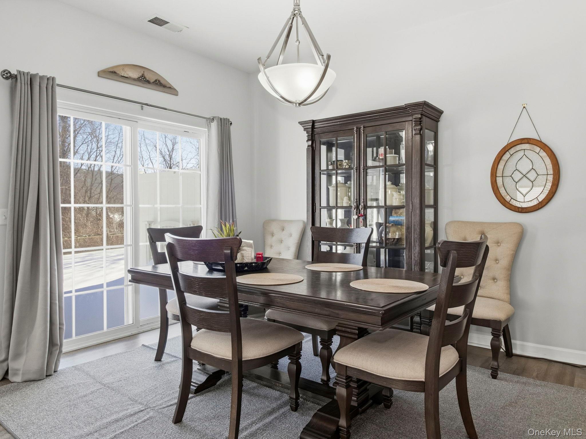 15 Revolution Road Cold Spring, NY 10516 - Photo 11 of 30 a view of a dining room with furniture window and wooden floor