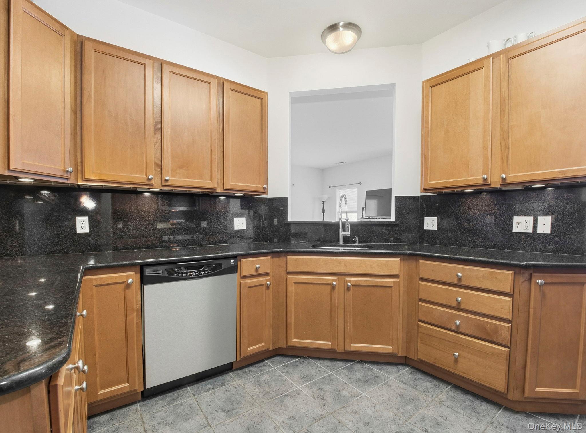 15 Revolution Road Cold Spring, NY 10516 - Photo 12 of 30 a kitchen with granite countertop a sink a stove and cabinets