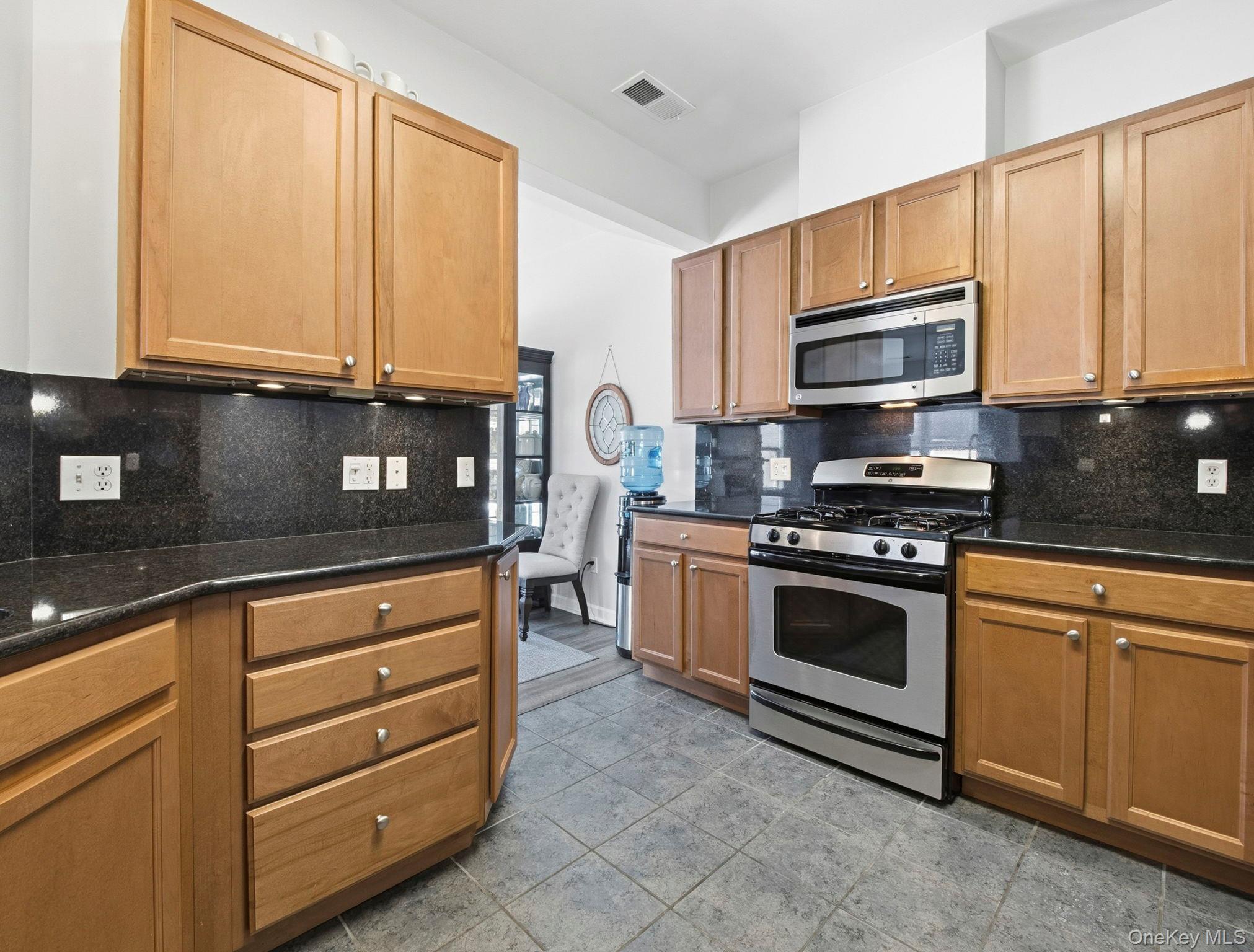 15 Revolution Road Cold Spring, NY 10516 - Photo 13 of 30 a kitchen with stainless steel appliances granite countertop a stove a sink and a microwave