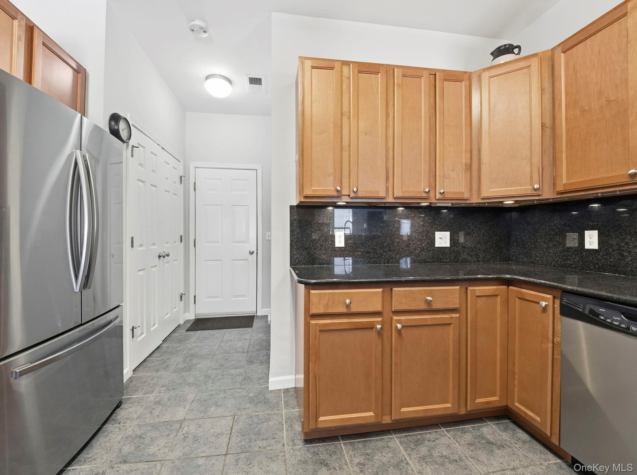 15 Revolution Road Cold Spring, NY 10516 - Photo 14 of 30 a kitchen with granite countertop a refrigerator and cabinets