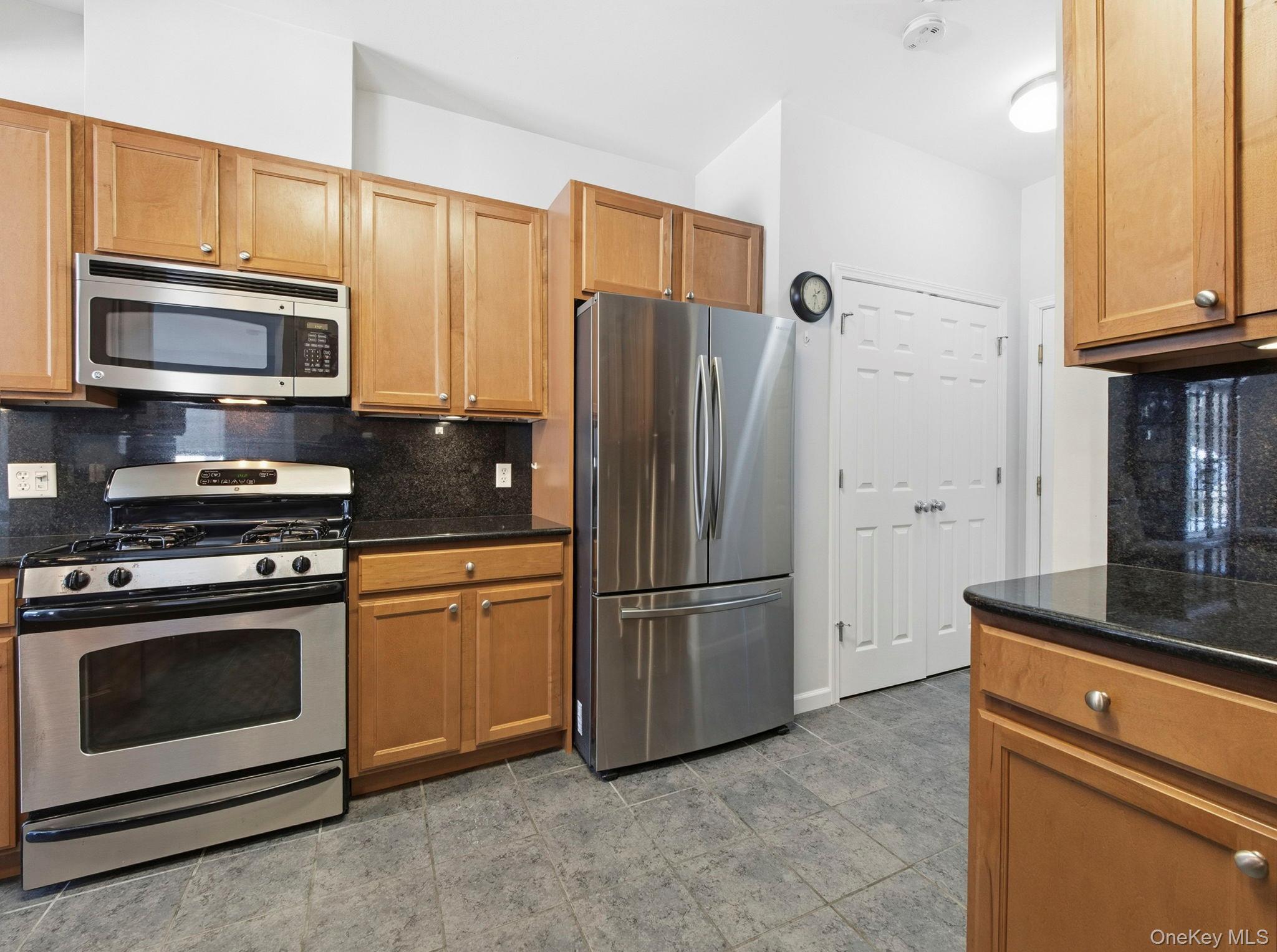 15 Revolution Road Cold Spring, NY 10516 - Photo 15 of 30 a kitchen with stainless steel appliances granite countertop a refrigerator stove and microwave