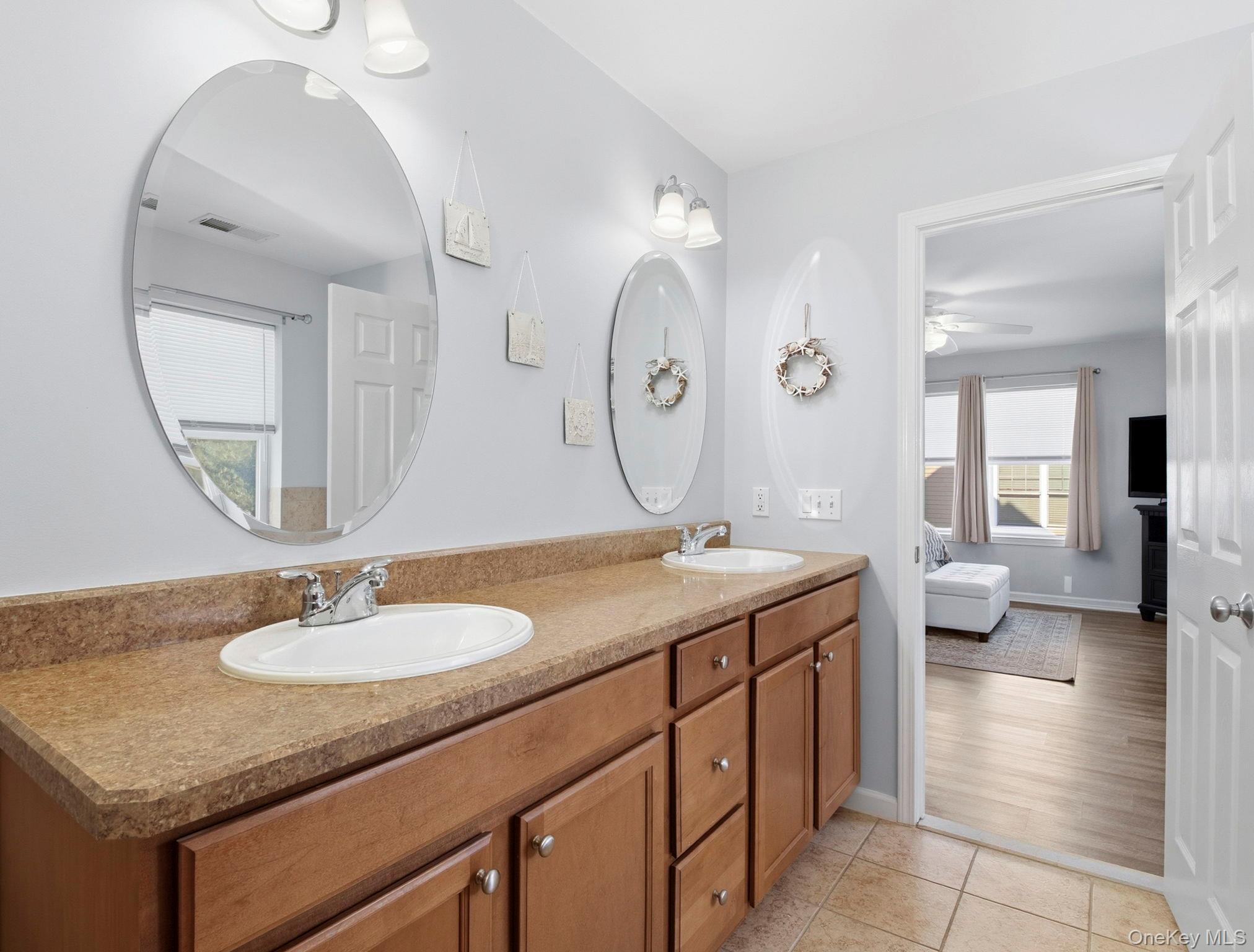 15 Revolution Road Cold Spring, NY 10516 - Photo 19 of 30 a en suite bathroom with a granite countertop sink a toilet and a mirror
