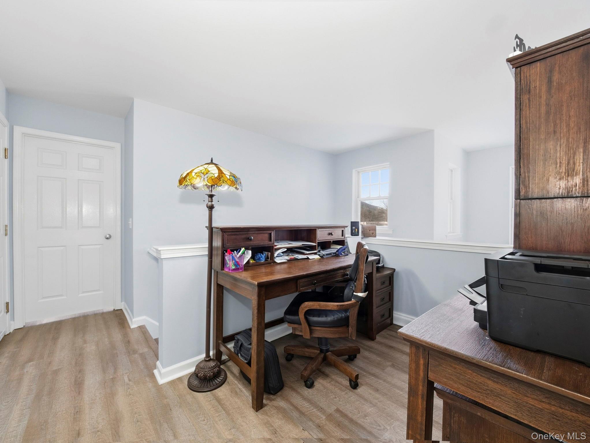 15 Revolution Road Cold Spring, NY 10516 - Photo 23 of 30 a workspace with furniture and wooden floor