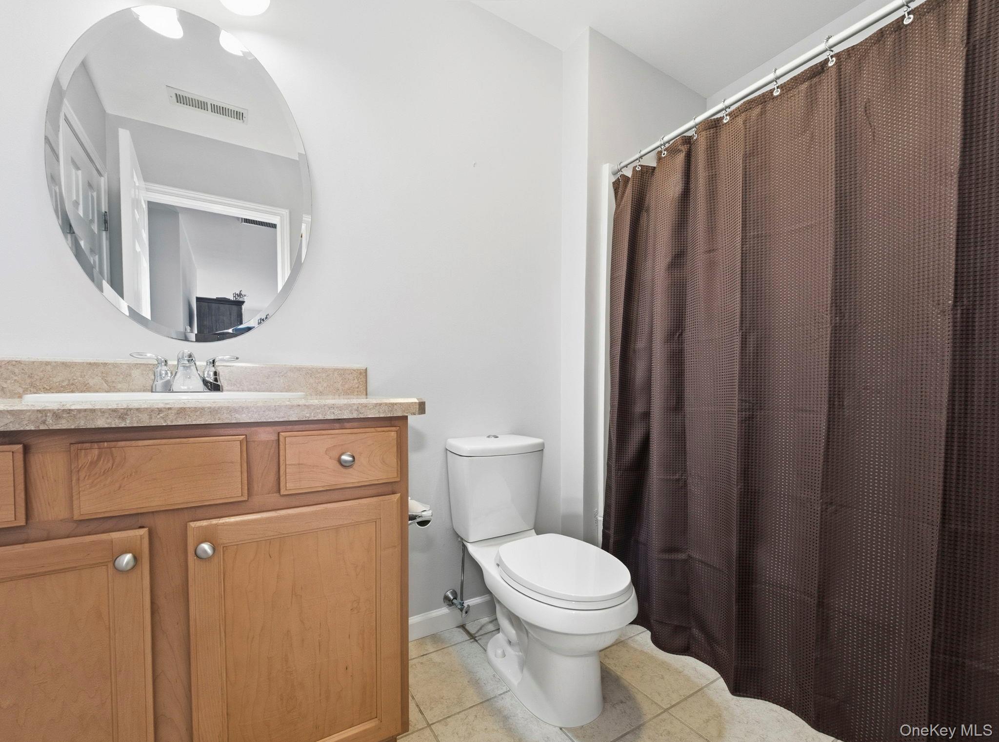 15 Revolution Road Cold Spring, NY 10516 - Photo 24 of 30 a bathroom with a sink a toilet and mirror