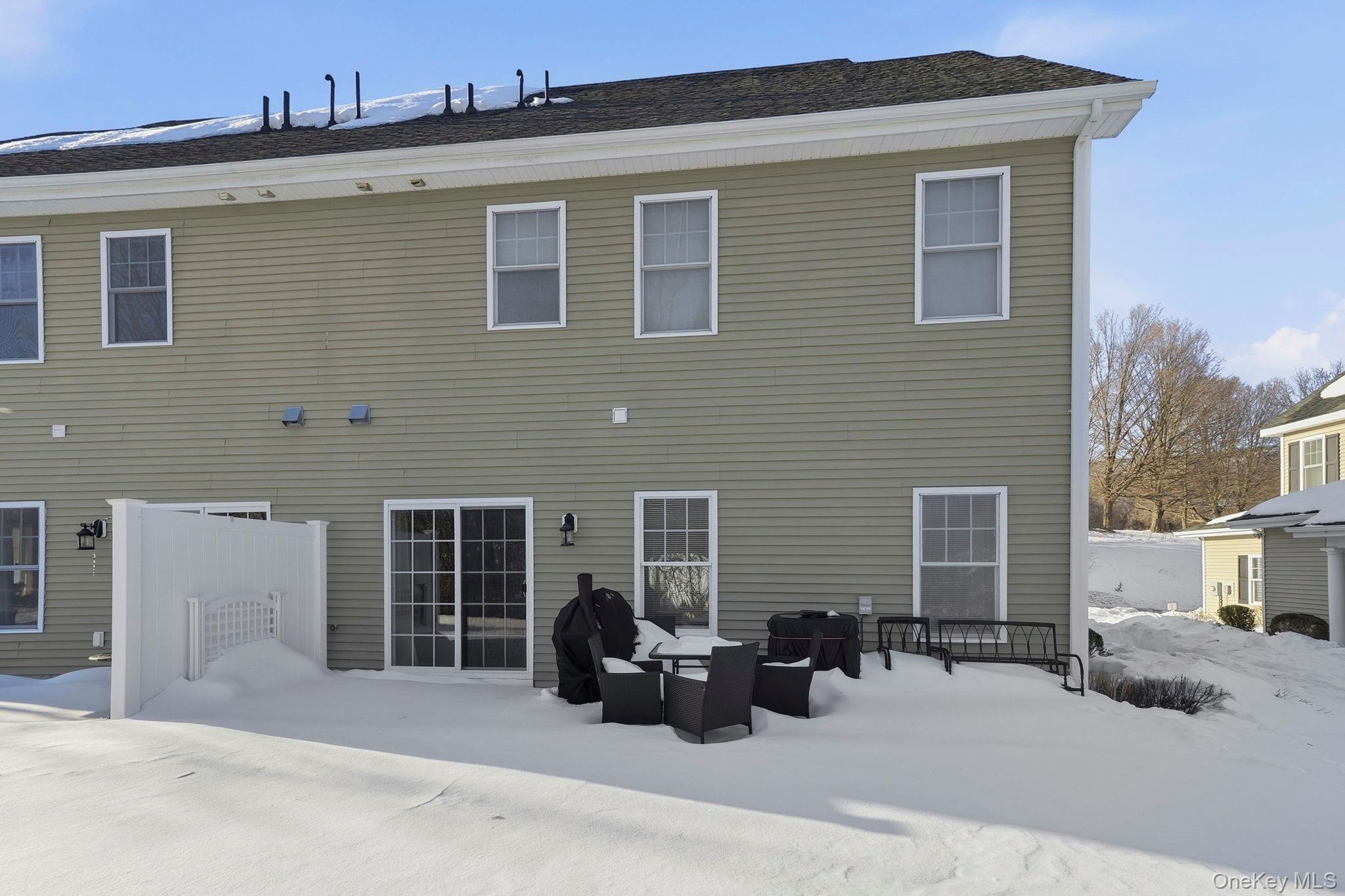 15 Revolution Road Cold Spring, NY 10516 - Photo 26 of 30 a view of a brick house with large windows and wooden roof