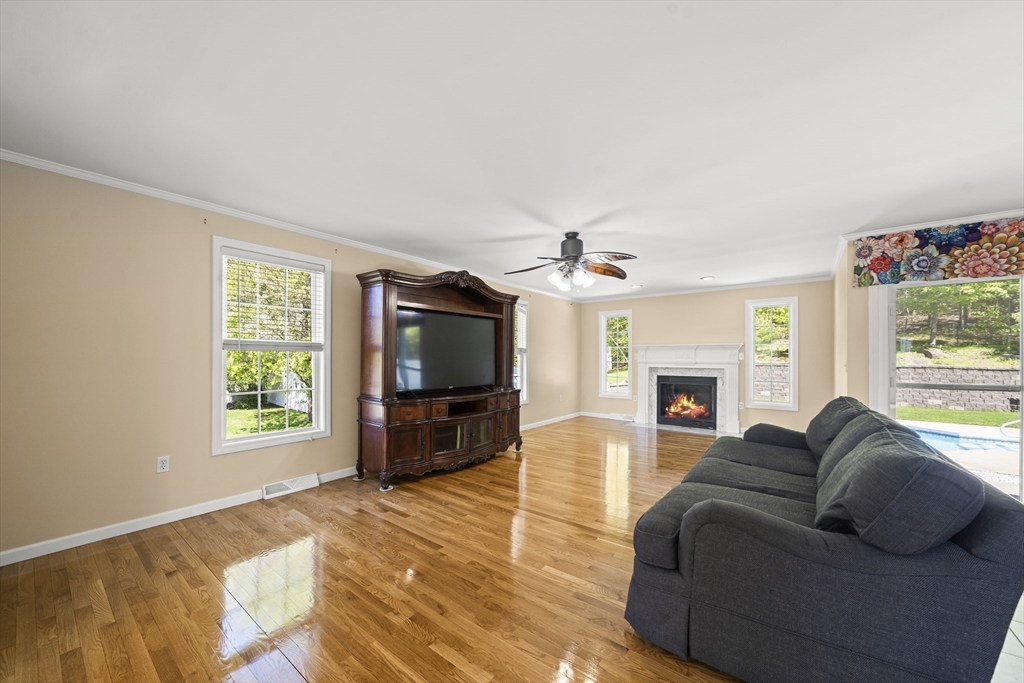1507 East Mountain Road Westfield, MA 01085 - Photo 11 of 42 a living room with furniture a flat screen tv and a fireplace