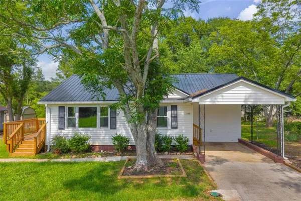 a front view of a house with a yard