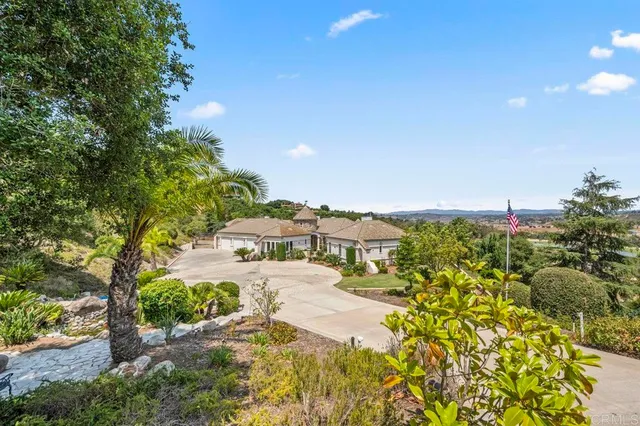 a view of a swimming pool with a yard