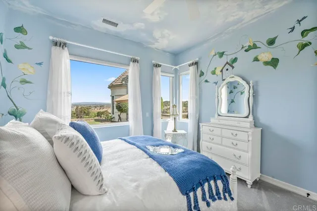 a bed room with bed and window