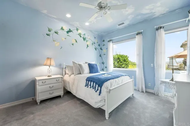 a room with furniture a flat screen tv and a fireplace