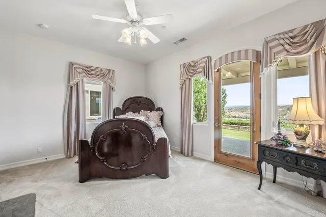 a large kitchen with granite countertop a sink and cabinets