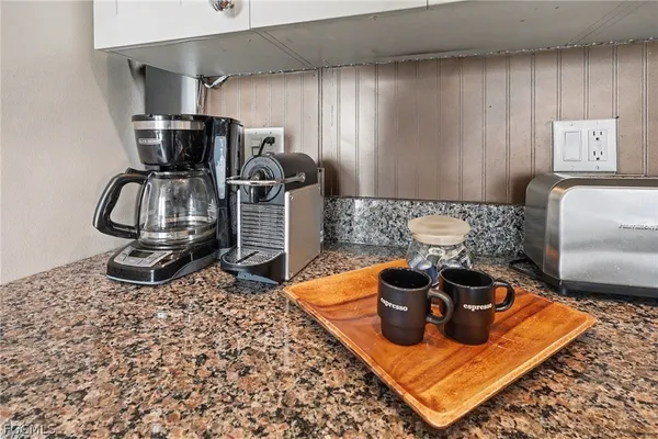 a room with furniture a rug and gym equipment