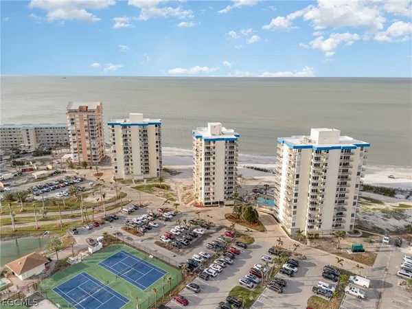 a view of ocean with a multi story building