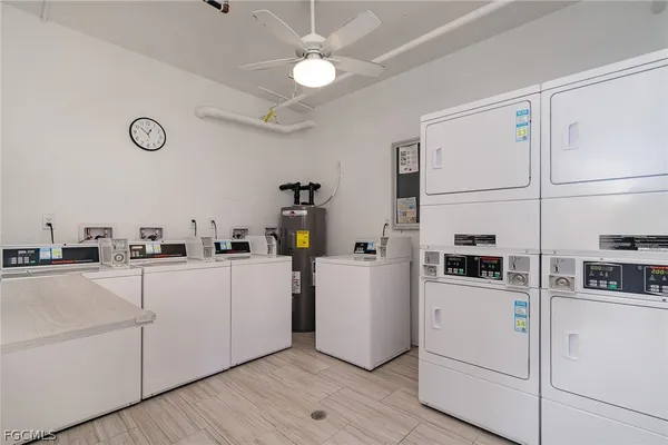a kitchen with cabinets and white stainless steel appliances