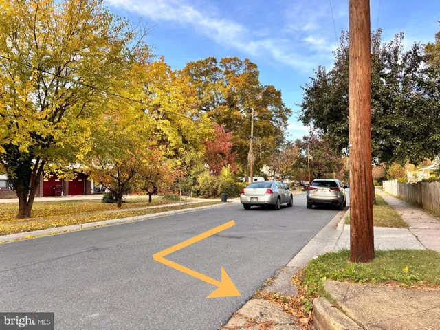 a view of street with parked cars