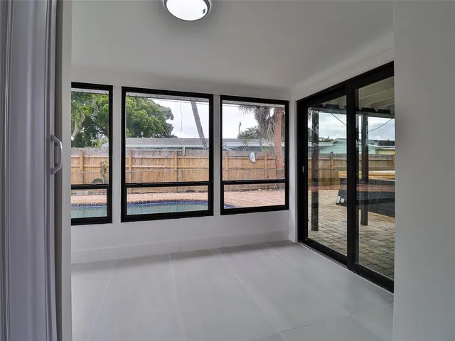 a view of empty room with floor to ceiling window
