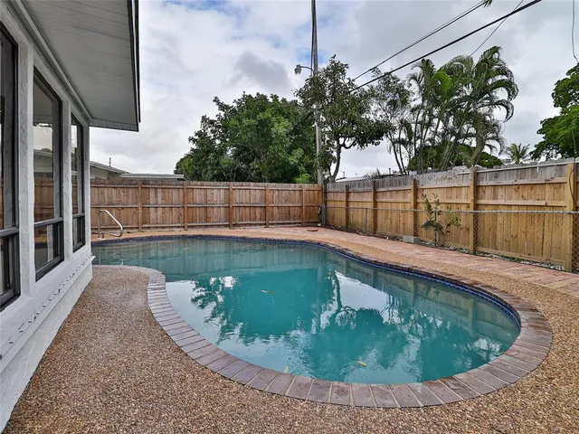 a view of a swimming pool with a patio