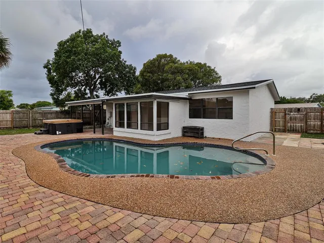 a front view of a house with swimming pool