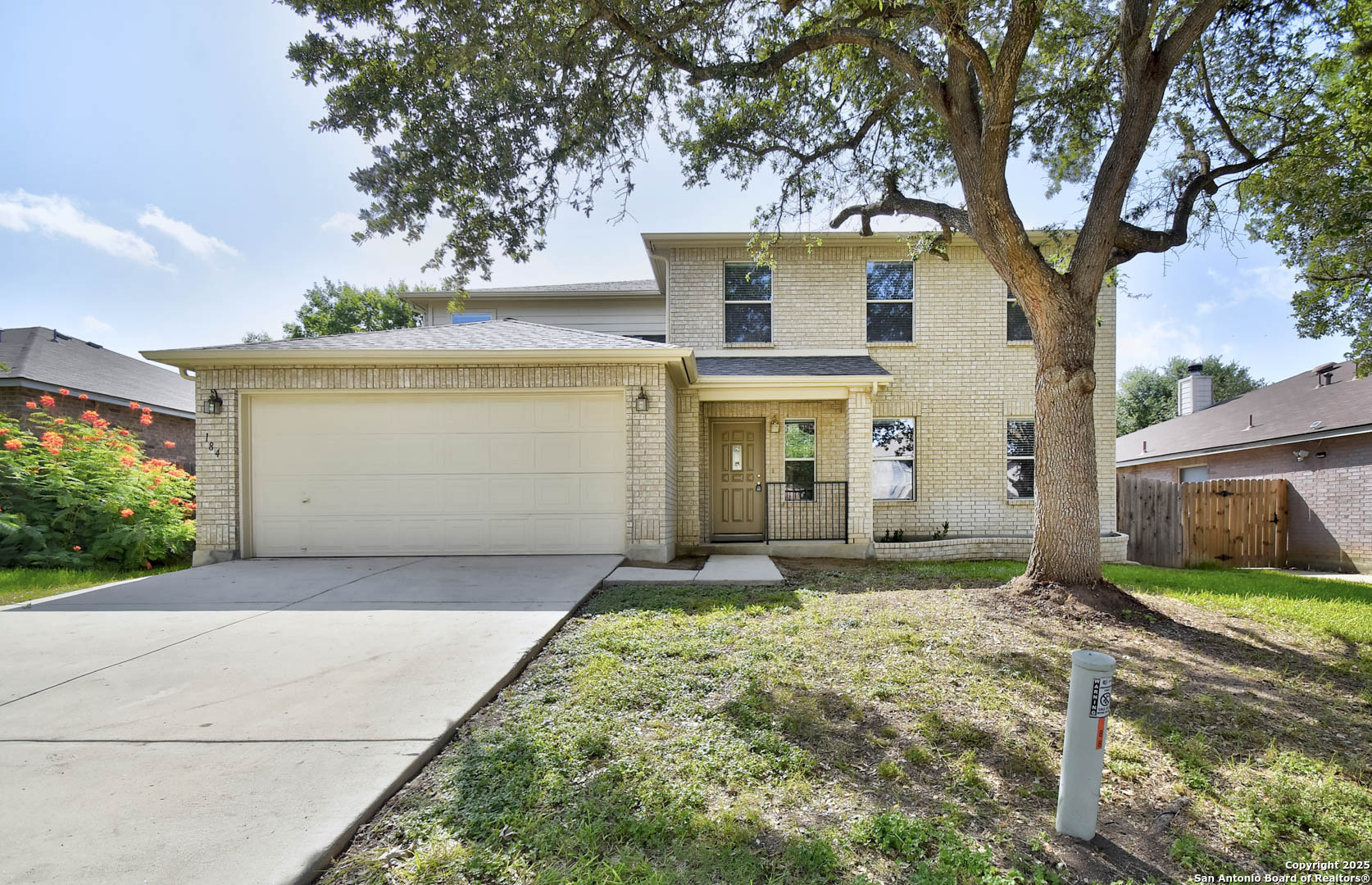 184 Springtree Parkway Cibolo, TX 78108 - Photo 2 of 36 a front view of a house with a yard and garage