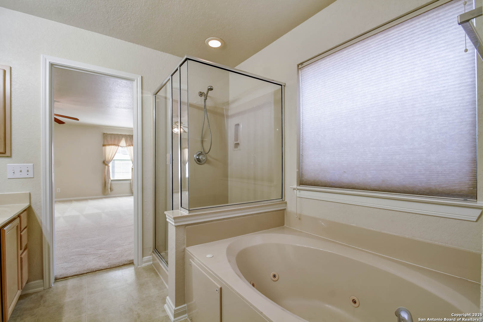 184 Springtree Parkway Cibolo, TX 78108 - Photo 22 of 36 a bathroom with a bathtub and a shower