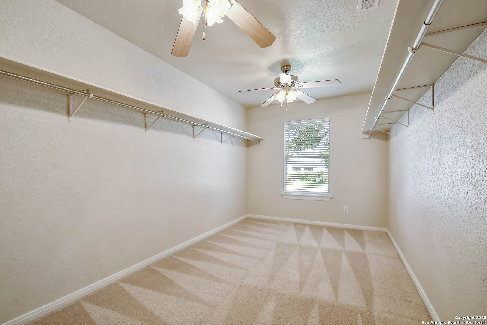 184 Springtree Parkway Cibolo, TX 78108 - Photo 23 of 36 a view of an empty room with a window