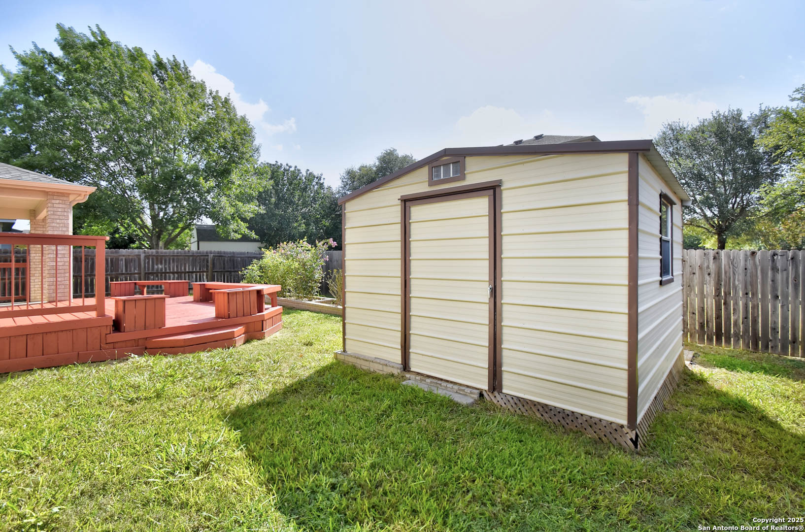 184 Springtree Parkway Cibolo, TX 78108 - Photo 36 of 36 a view of a backyard with table and chairs and a barbeque