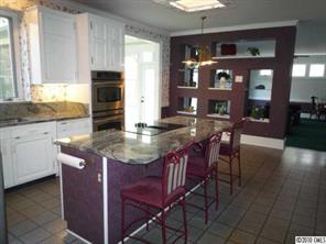 2628 Farmlake Lane Fort Mill, SC 29708 - Photo 5 of 16 a kitchen with stainless steel appliances granite countertop a table chairs sink and cabinets