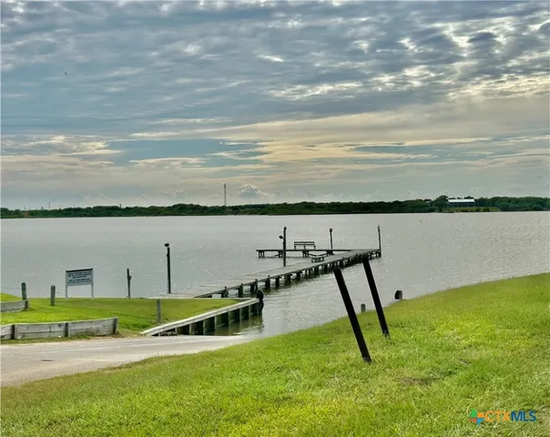 a view of a lake with a yard