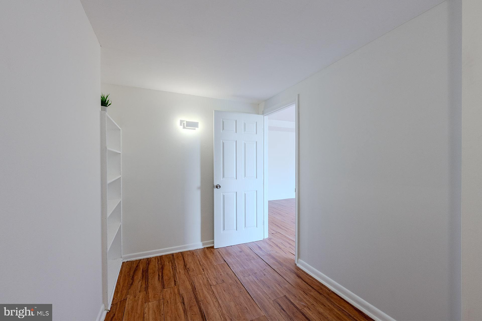 4410 Oglethorpe Street, Unit 713 Hyattsville, MD 20781 - Photo 11 of 24 a view of hallway with wooden floor