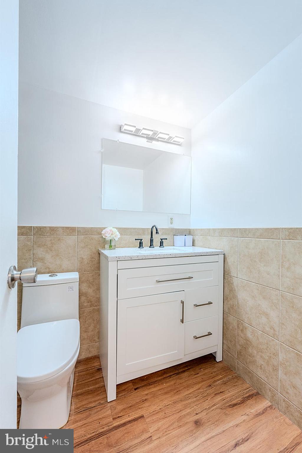 4410 Oglethorpe Street, Unit 713 Hyattsville, MD 20781 - Photo 19 of 24 a bathroom with a sink and a mirror