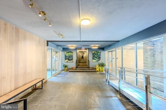 a view of a room with large windows