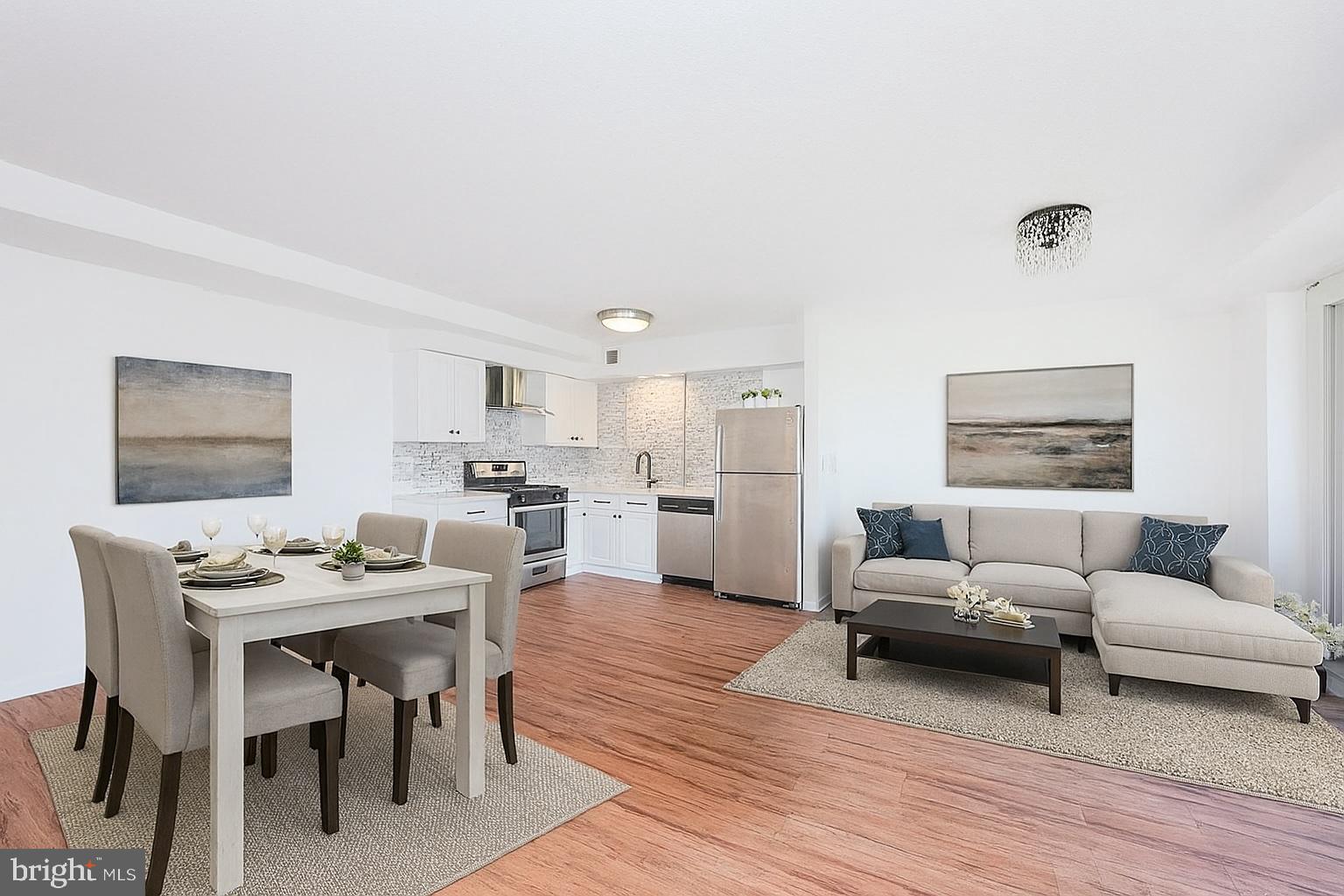 4410 Oglethorpe Street, Unit 713 Hyattsville, MD 20781 - Photo 5 of 24 a living room with furniture and a wooden floor