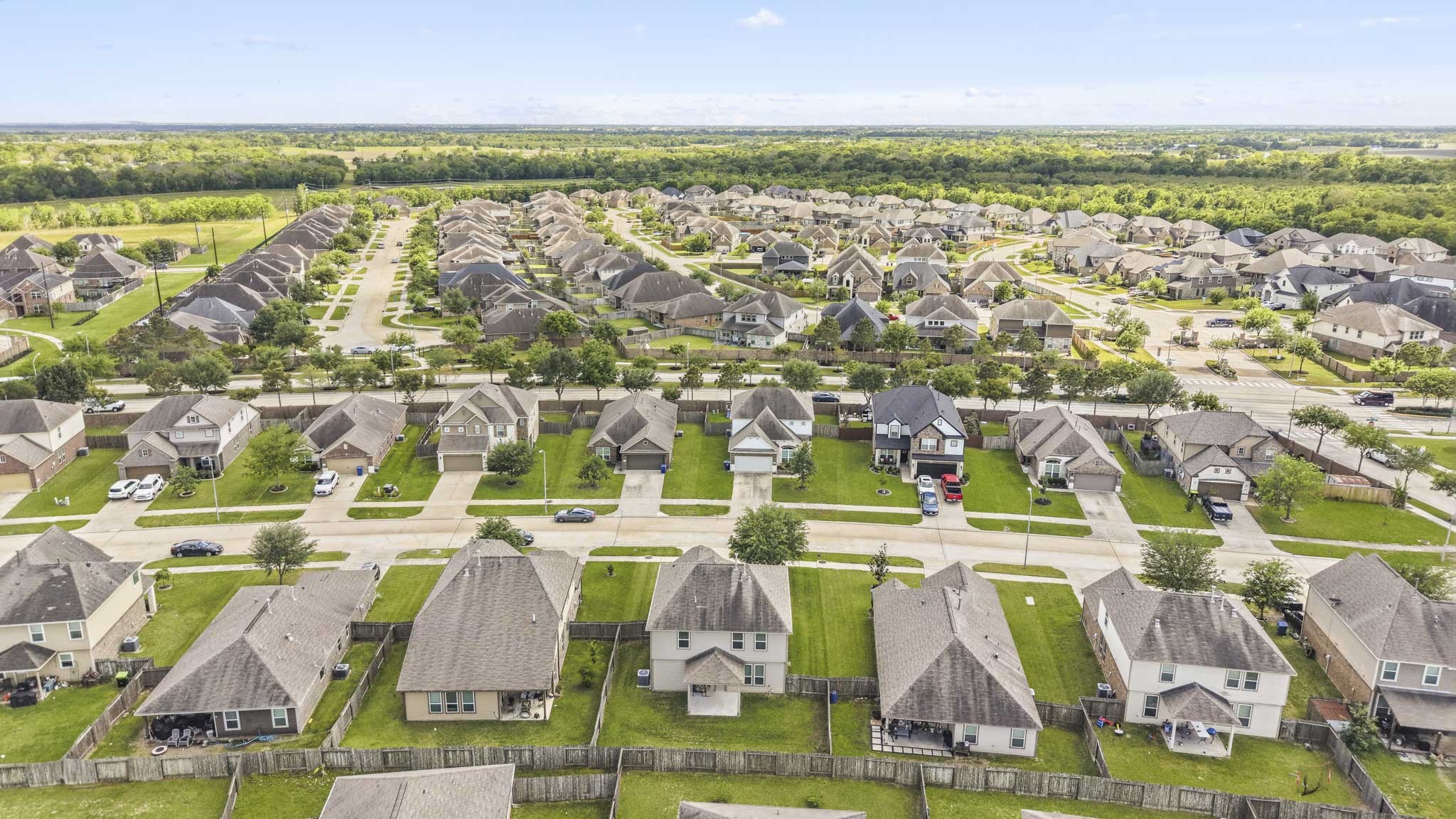 3010 Coachmaker Trail Rosenberg, TX 77471 - Photo 24 of 26 The focal point is a framed illustration featuring a modern, minimalist figure with rich tones and clean lines, set against a soft, neutral background with botanical accents. The artwork blends earthy colors and natural elements, creating a calming, curated aesthetic that feels both contemporary and inviting.
