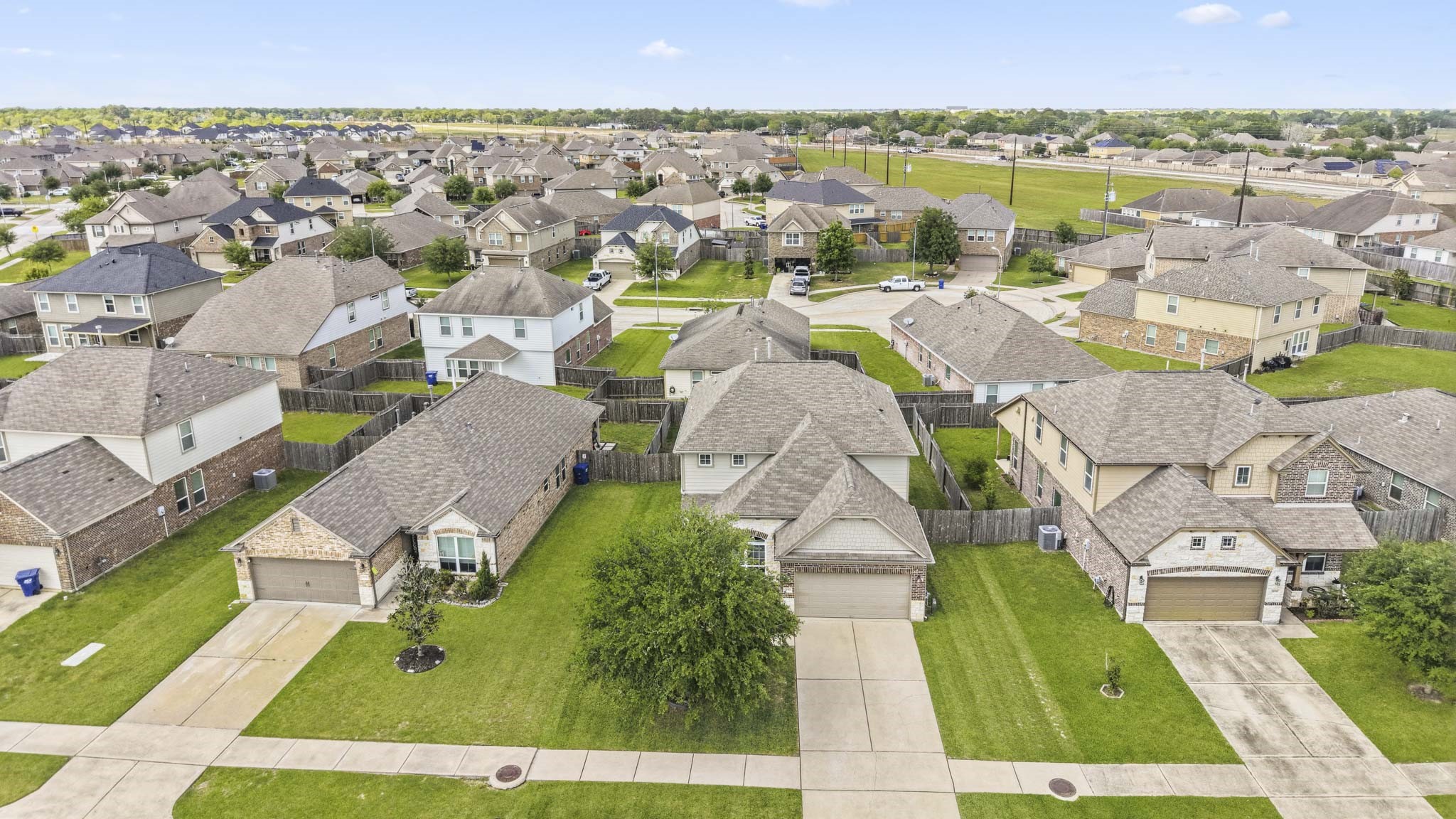 3010 Coachmaker Trail Rosenberg, TX 77471 - Photo 25 of 26 Just beyond the frame, a glimpse of the surrounding neighborhood can be seen, subtly connecting the interior design to the larger community setting.