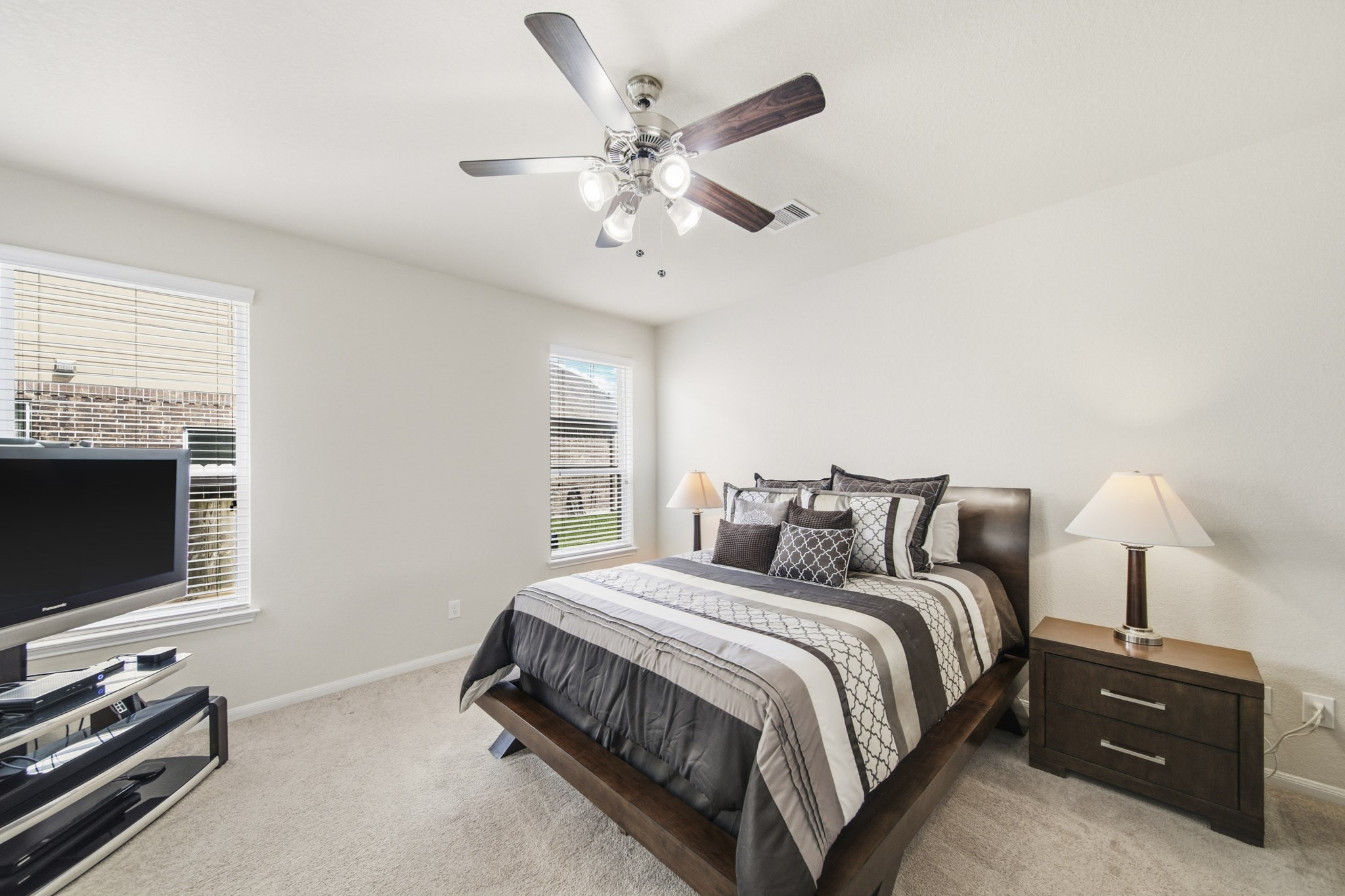 3010 Coachmaker Trail Rosenberg, TX 77471 - Photo 7 of 26 A great place to rest after a long day! This master bedroom features carpet floors, beautiful dark stained ceiling fan, and windows with privacy blinds.