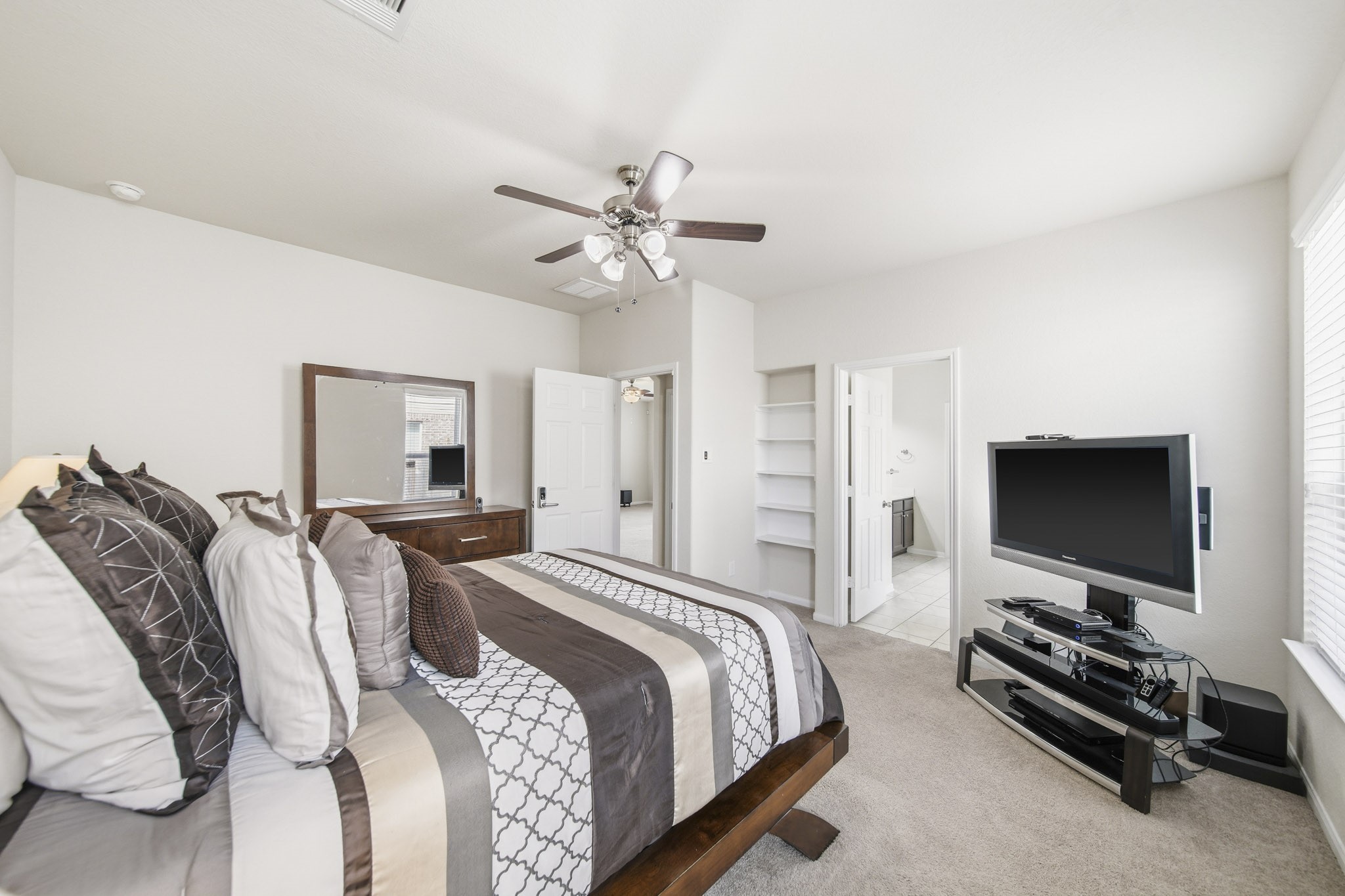 3010 Coachmaker Trail Rosenberg, TX 77471 - Photo 8 of 26 Another view of the primary bedroom highlights its spacious layout, with direct access to the bathroom and a walk-in closet.