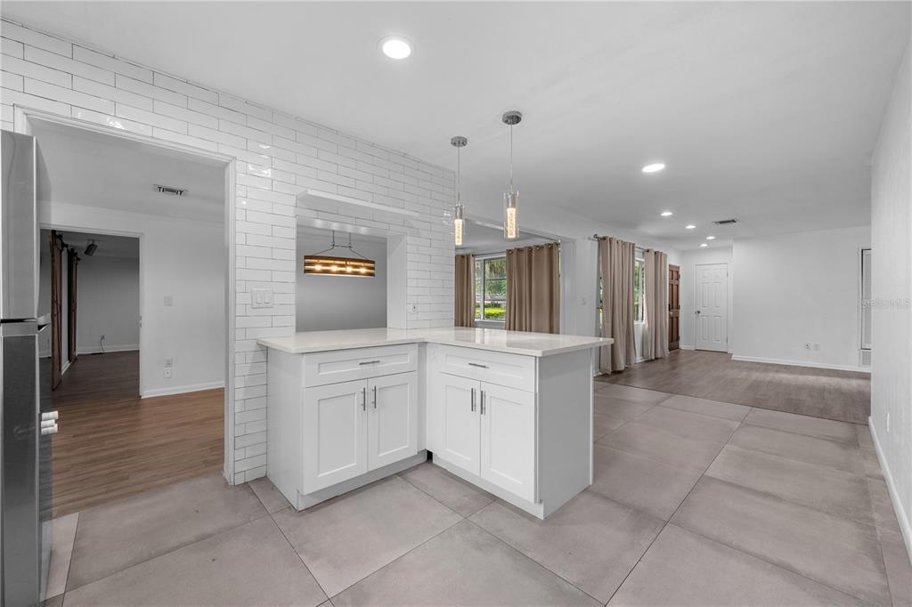 601 Oranole Road Altamonte Springs, FL 32701 - Photo 11 of 36 a large kitchen with a lot of counter space and a sink