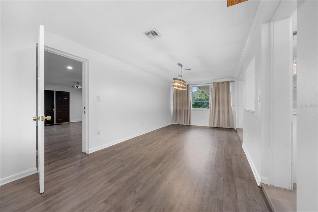 601 Oranole Road Altamonte Springs, FL 32701 - Photo 13 of 36 wooden floor in an empty room with a window
