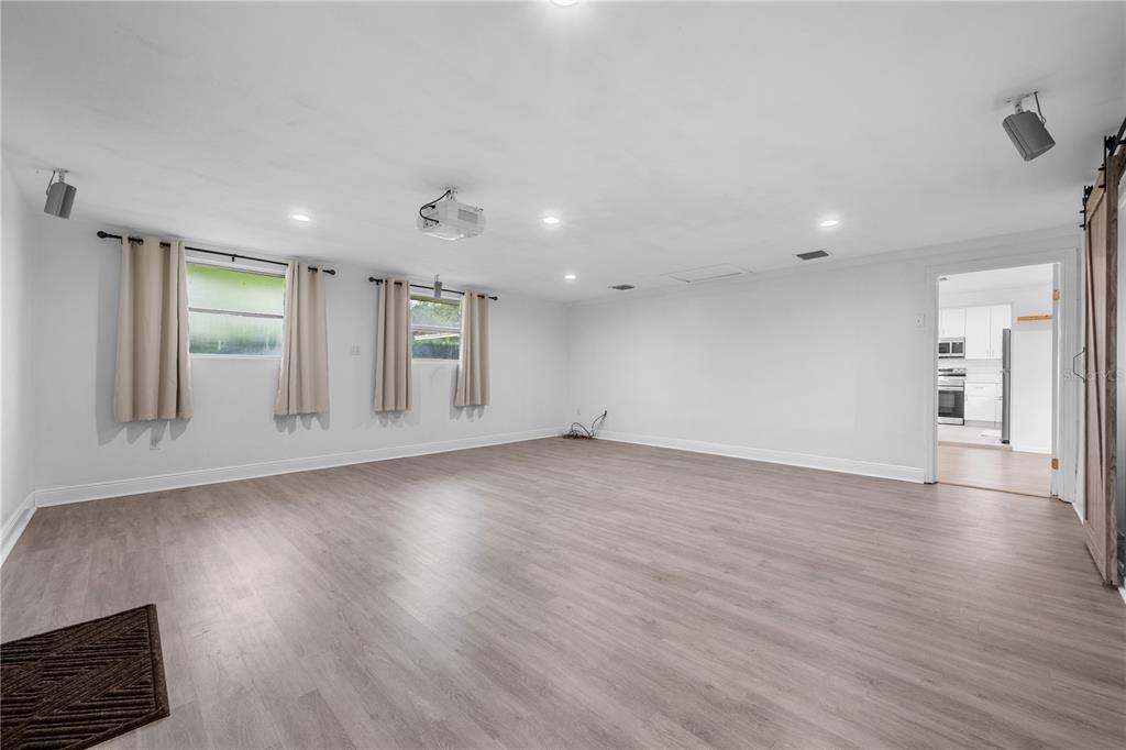 601 Oranole Road Altamonte Springs, FL 32701 - Photo 15 of 36 an empty room with wooden floor and windows