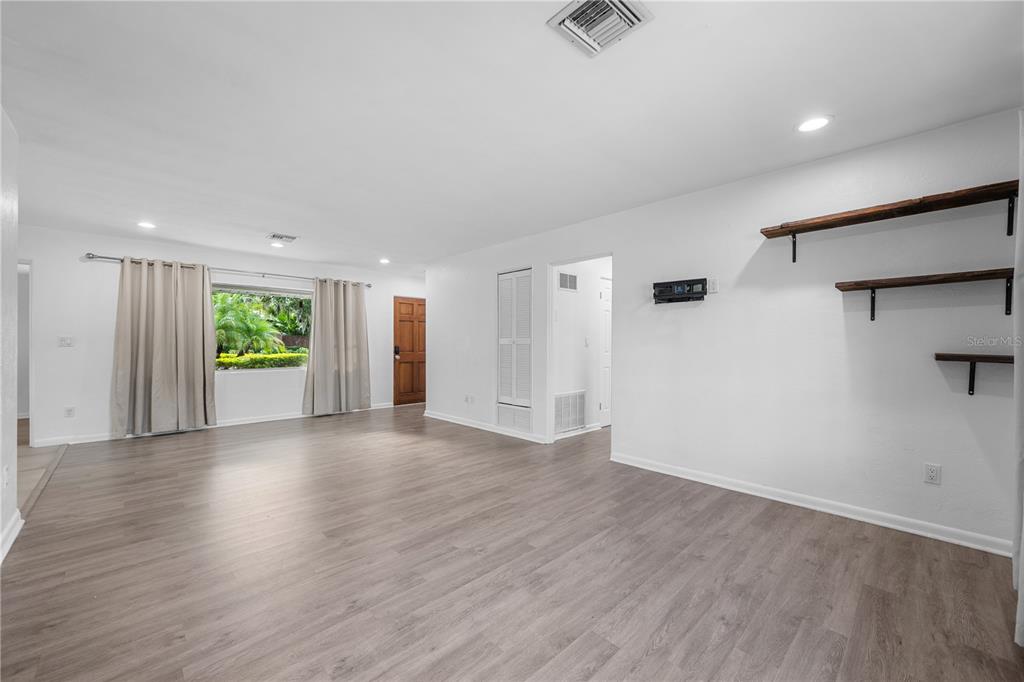 601 Oranole Road Altamonte Springs, FL 32701 - Photo 18 of 36 an empty room with wooden floor and windows