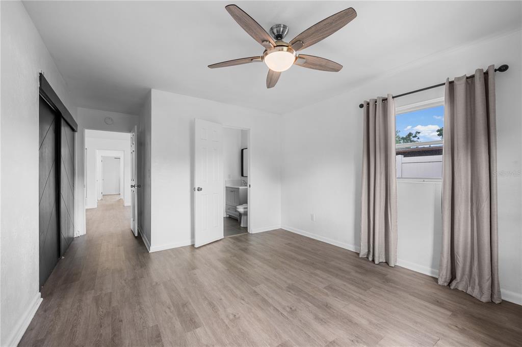 601 Oranole Road Altamonte Springs, FL 32701 - Photo 23 of 36 wooden floor in an empty room with a window