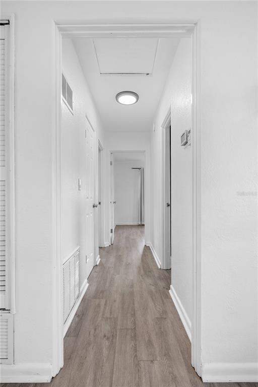 601 Oranole Road Altamonte Springs, FL 32701 - Photo 28 of 36 a view of a hallway with wooden floor