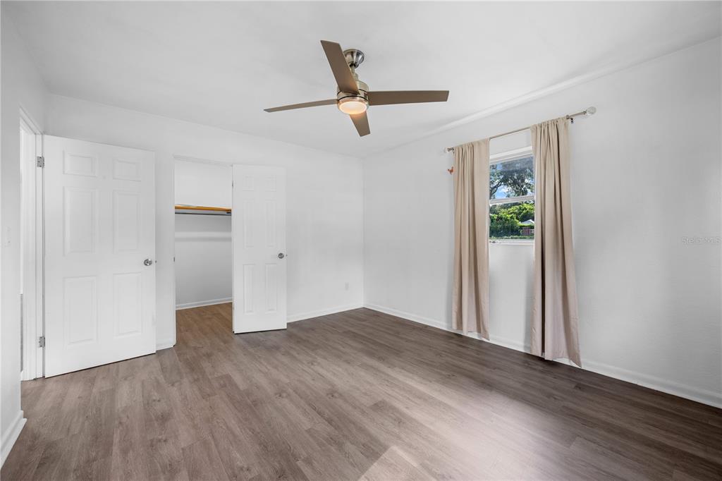 601 Oranole Road Altamonte Springs, FL 32701 - Photo 33 of 36 an empty room with wooden floor and windows