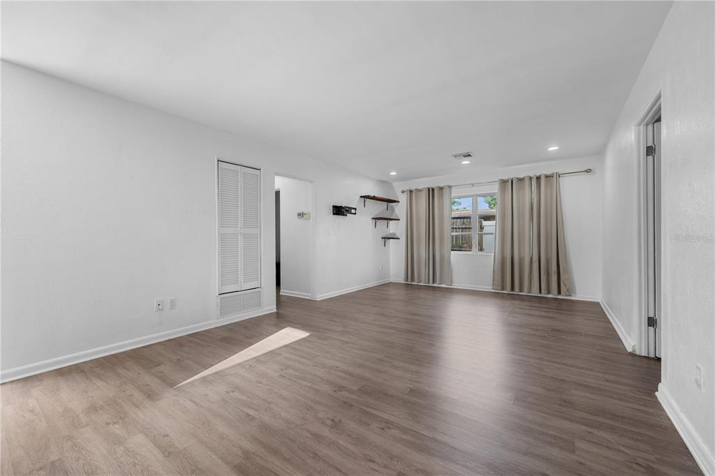 601 Oranole Road Altamonte Springs, FL 32701 - Photo 6 of 36 a view of a livingroom with wooden floor