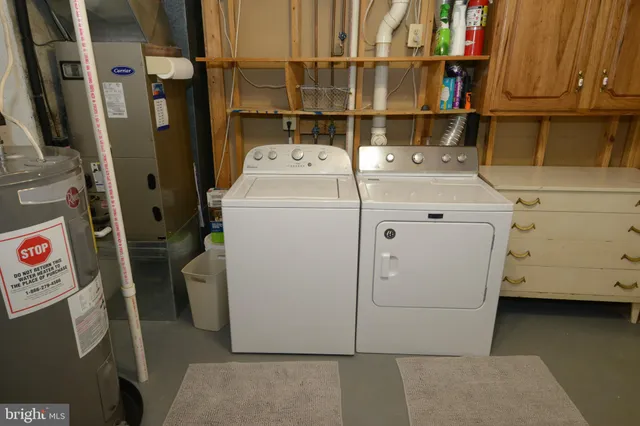 a utility room with dryer and washer
