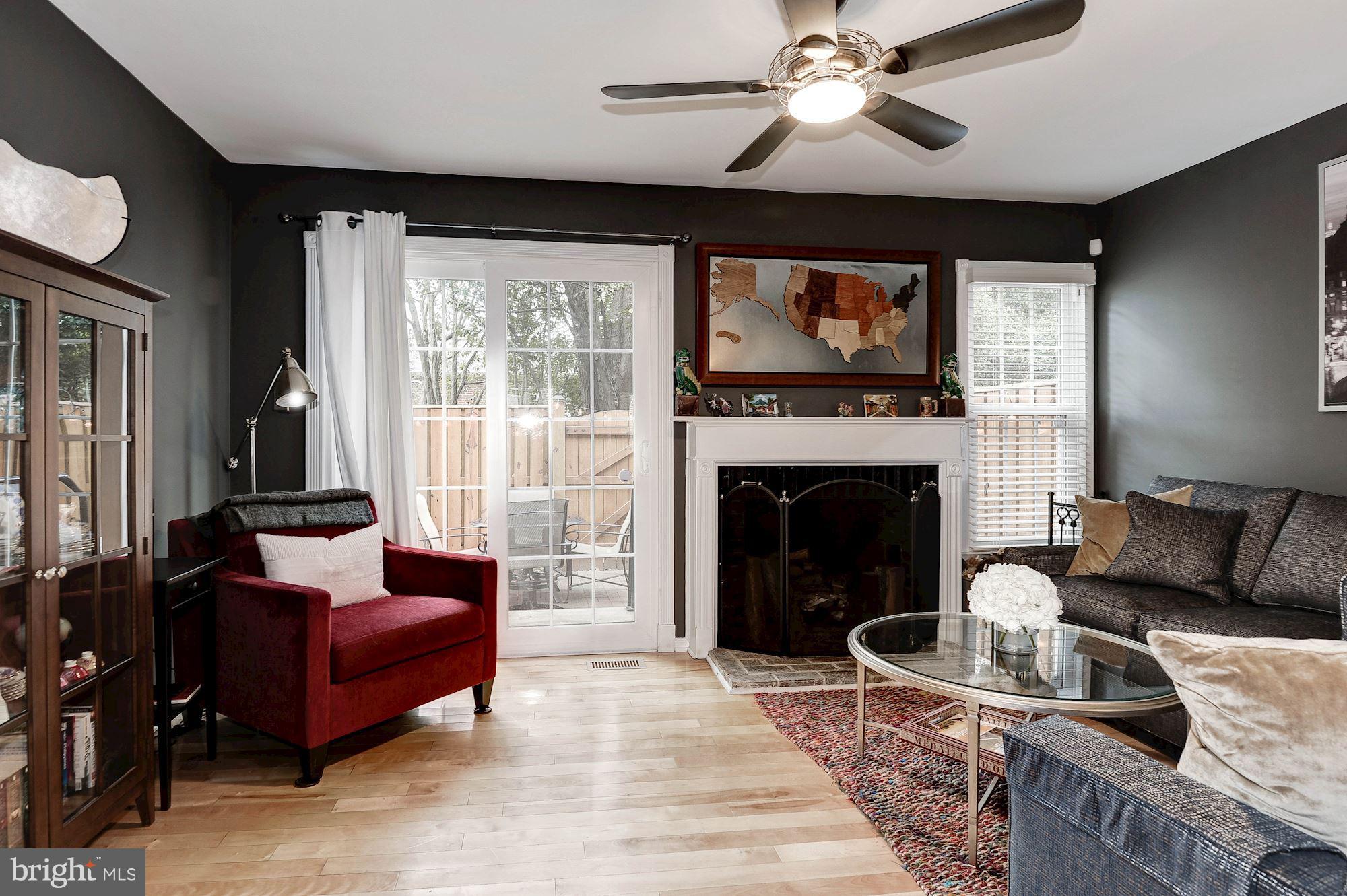 2546 South Walter Reed Drive, Unit 3 Arlington, VA 22206 - Photo 11 of 30 a living room with furniture and a fireplace