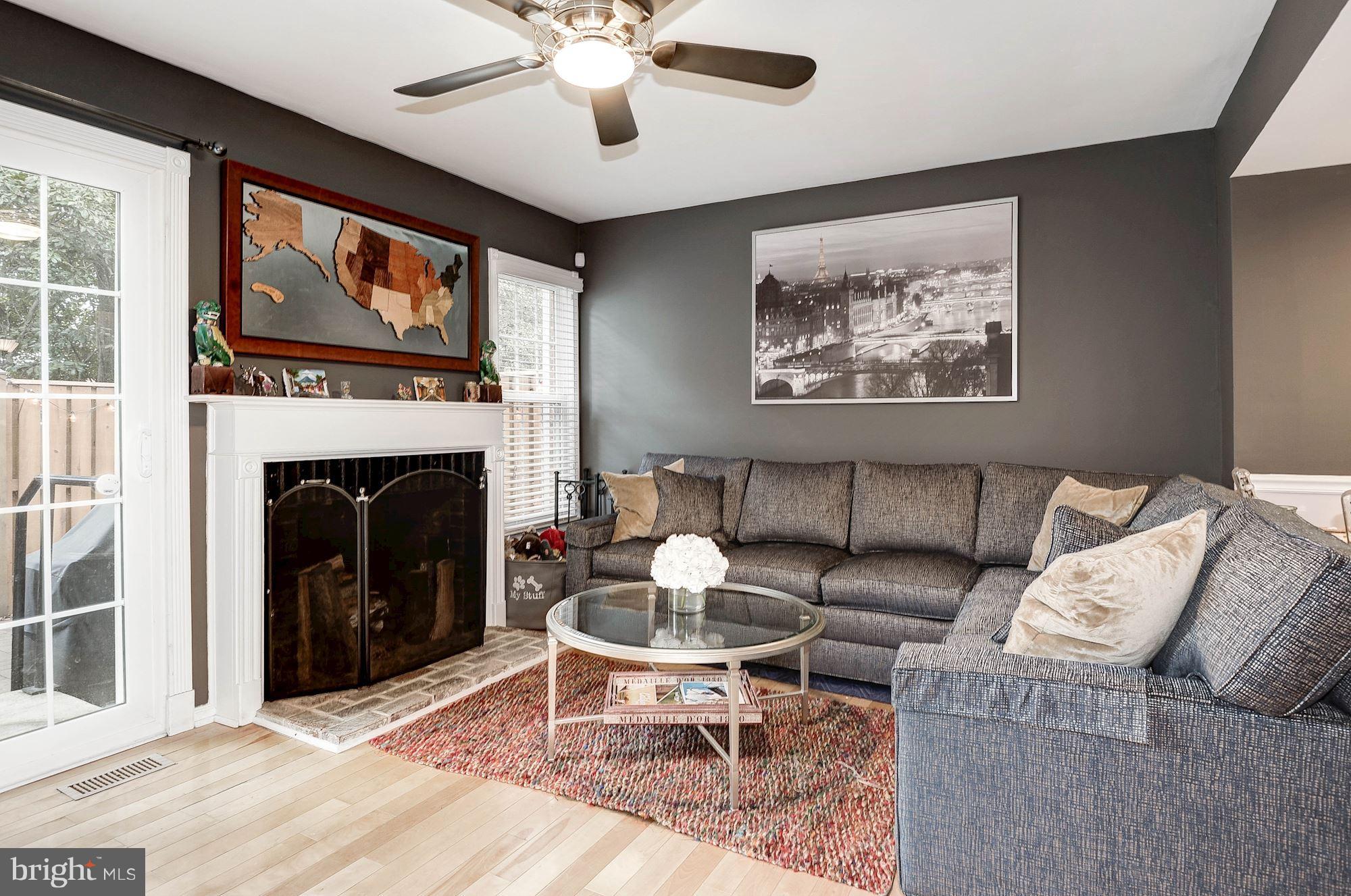 2546 South Walter Reed Drive, Unit 3 Arlington, VA 22206 - Photo 12 of 30 a living room with furniture a window and a fireplace